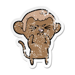 distressed sticker of a cartoon annoyed monkey