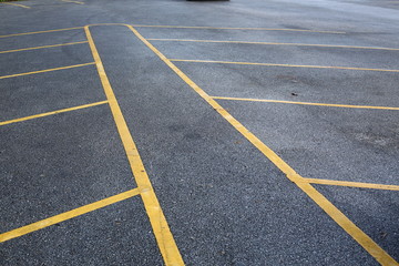 Fototapeta premium yellow line marking on black asphalt road