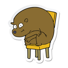 sticker of a cartoon bear sitting on chair