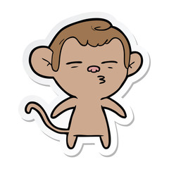 sticker of a cartoon suspicious monkey