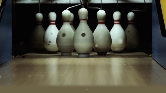 Bowling Pins And Dust. Zoom Out.
