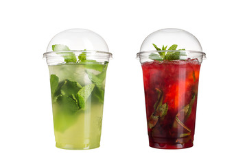 Delicious fruit smoothies in plastic cups, on a white background. Two cocktails with a taste of mojito and berry mojito.