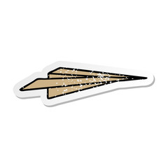 distressed sticker of a cute cartoon paper aeroplane