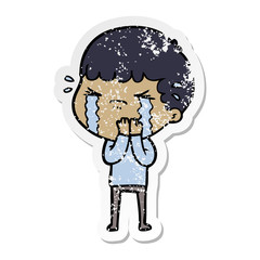 Obraz premium distressed sticker of a cartoon man crying