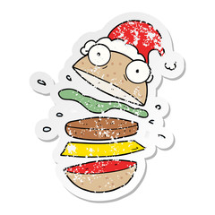 distressed sticker cartoon of a amazing burger wearing santa hat