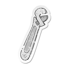 retro distressed sticker of a cartoon adjustable spanner