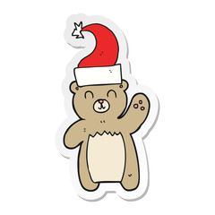 sticker of a cartoon teddy bear waving