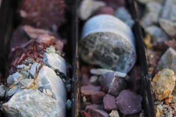 Stacking of old ore samples laying at the disposal area