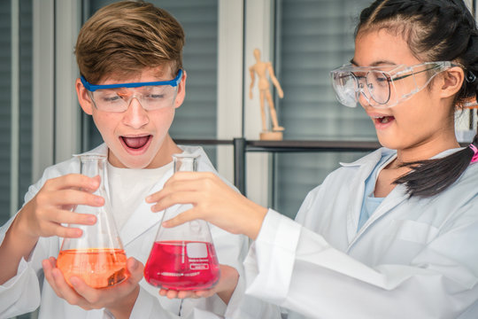students having chemistry experiment in science laboratory
