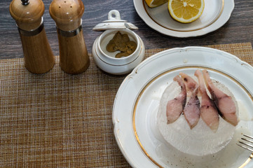 preparation of stroganina on the ice dish, sliced fishes with spices, bon appetit