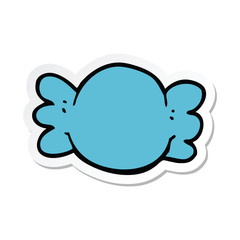 sticker of a cartoon wrapped candy