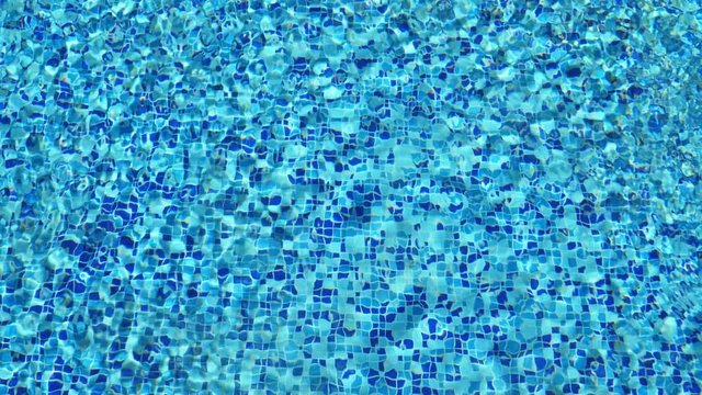 Surface of ripped water in swimming pool. Abstract background