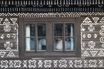 Window in architecture reserve in Čičmany, Žilina region, Slovakia