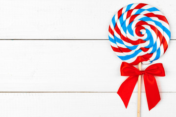 Obraz premium sugar lollipop on the wooden table