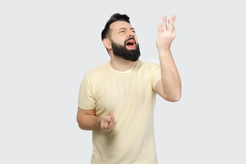Fototapeta premium The pretty bearded man shows emotionally