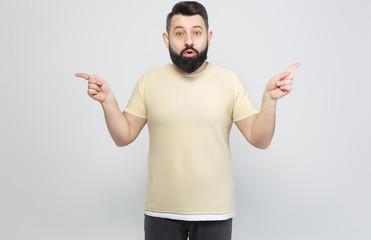 Fototapeta premium The pretty bearded man shows emotionally