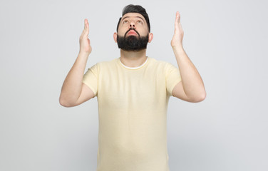 Naklejka premium The pretty bearded man shows emotionally