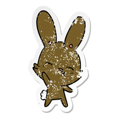distressed sticker of a curious waving bunny cartoon