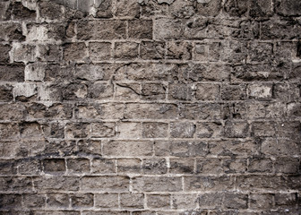 Closeup of old grey and rough sandstone wall. For pattern, texture and background