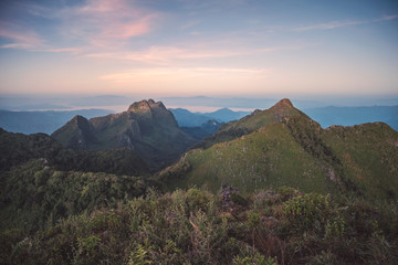 Landscape of mountain range in wildlife sanctuary at sunset