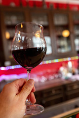 Glass of red wine on a bar counter