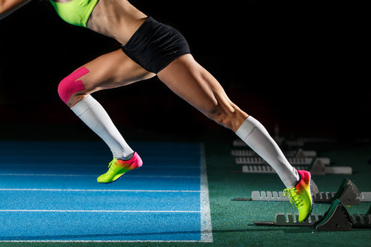 Female athlete starting her sprint race running