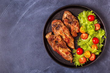 Roasted turkey steak with salad.