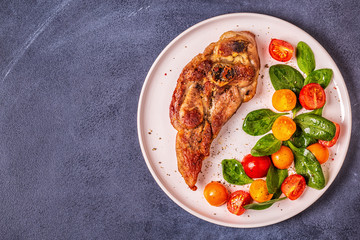 Roasted turkey steak with salad.