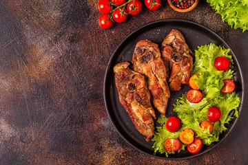 Roasted turkey steak with salad.