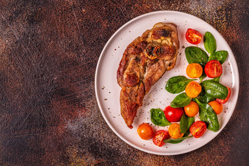 Roasted turkey steak with salad.