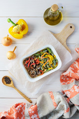 Frozen chicken heart dish with vegetables in a container