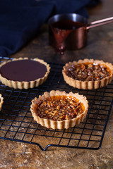 Chocolate tarts on a cooling rack