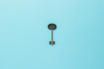 The key is on the blue cardboard. The concept of buying a home, mortgage, home loan, planning. Flat lay, top view