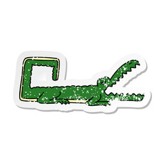 distressed sticker of a quirky hand drawn cartoon crocodile