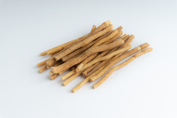 Natural toothbrush Miswak (Kayu Sugi) on white background 