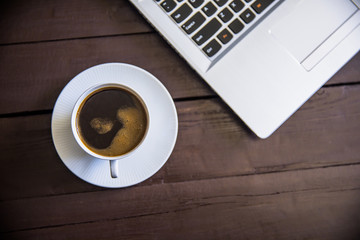 Obraz na płótnie Canvas computer keyboard with cup of coffee