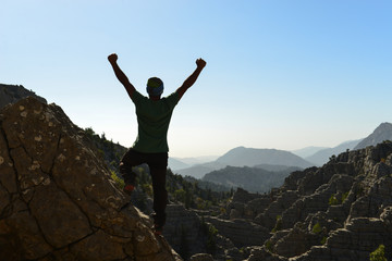 triumph of successful mountaineer in mystic mountains