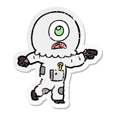 distressed sticker of a cartoon cyclops alien spaceman pointing