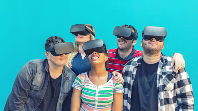 Multiracial diverse group of friends having fun together connecting with headset goggles, Digital generation trends - Powered by Adobe