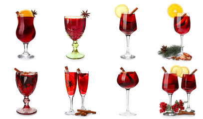 Set of glasses with tasty mulled wine on white background
