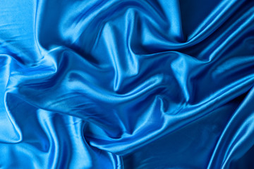 background texture, pattern. blue silk fabric, crumpled texture that adds interest and depth to any fabric design