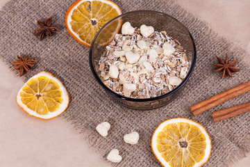 Healthy food. Muesli in a bowl on a light background. Porridge for breakfast on a linen background