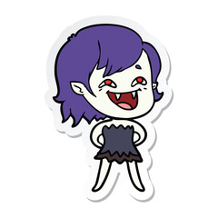 sticker of a cartoon laughing vampire girl
