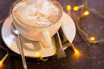 The cup of latte or cappuccino coffee with milk.