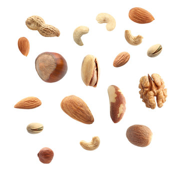 Falling nuts on white background