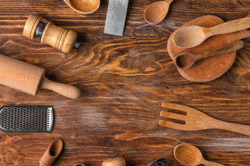 Set of kitchenware on wooden background