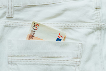 Obraz premium fifty euros in jeans, european money