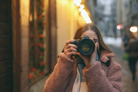 Female photographer outdoors on Christmas eve