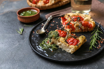 Tasty Italian focaccia and basil sauce on plate