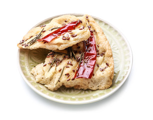 Plate with tasty Italian focaccia on white background